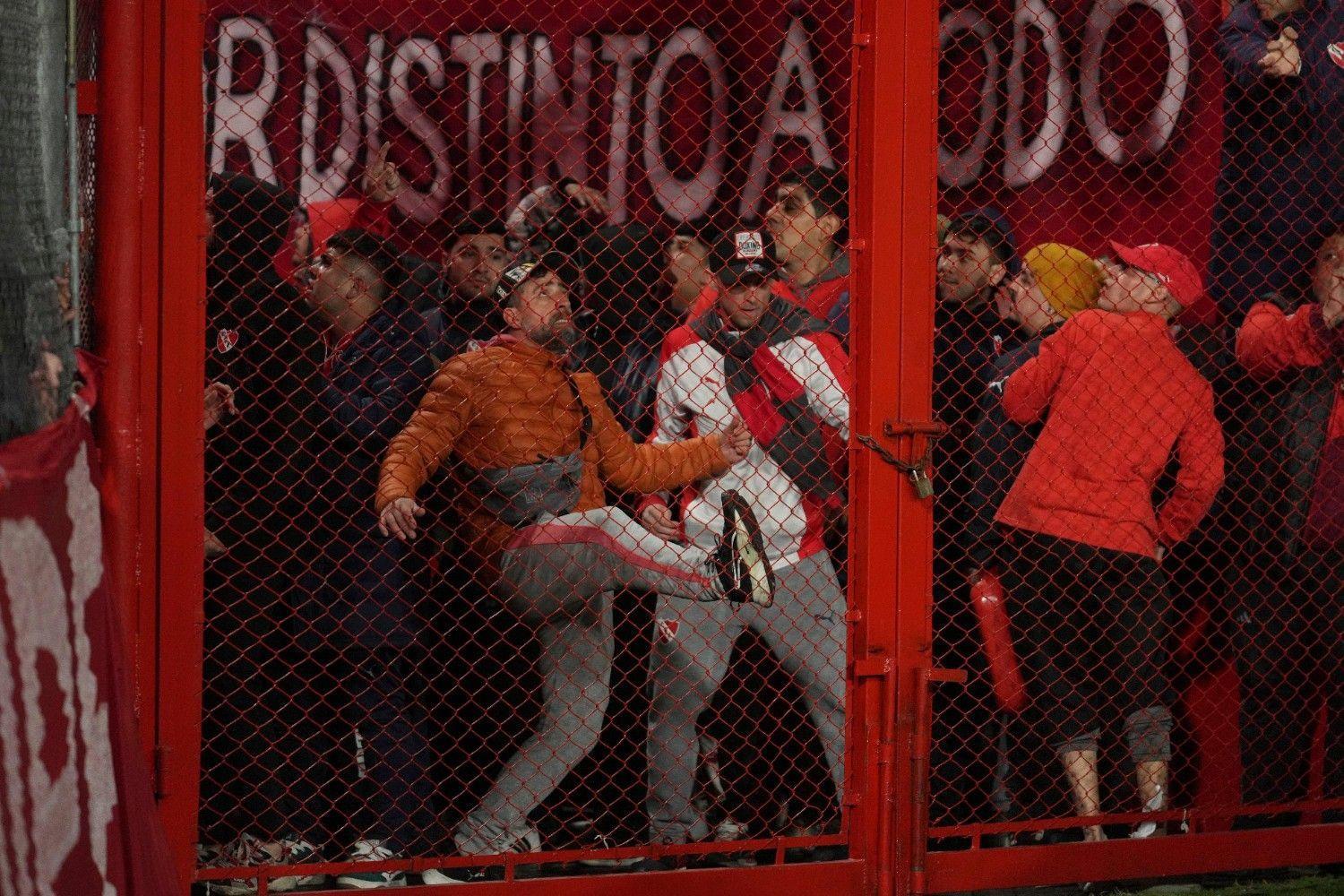 Ten hurt as match abandoned following fan violence