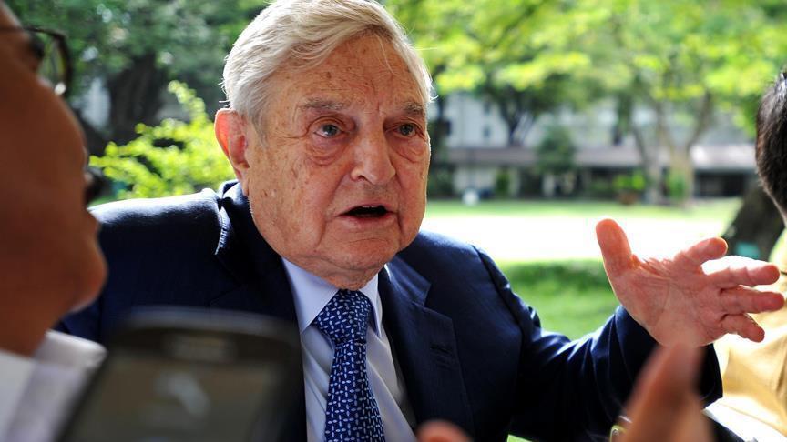 Trump urges criminal charges against George Soros, son