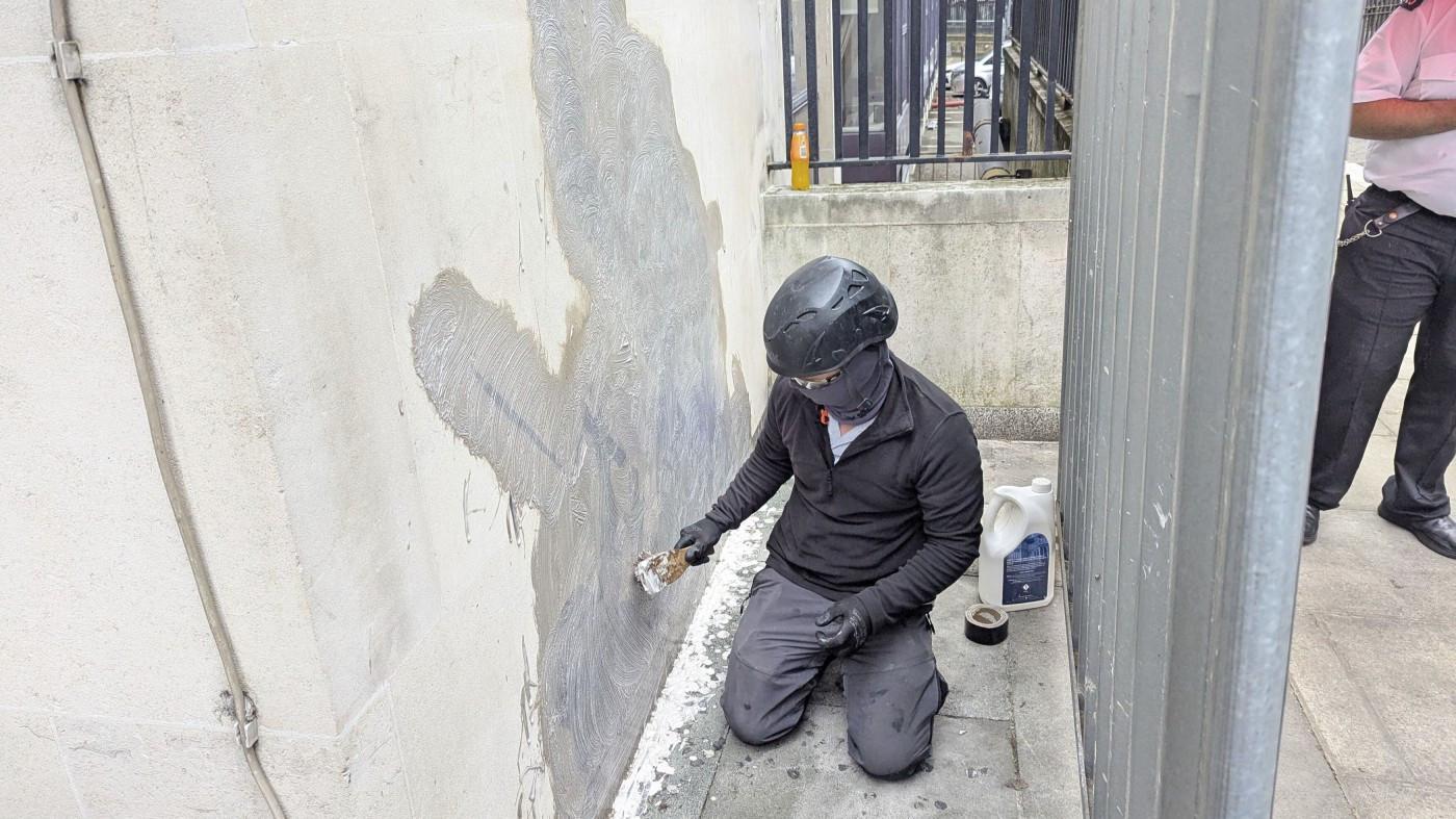 Banksy mural of a judge beating a protester scrubbed from London court