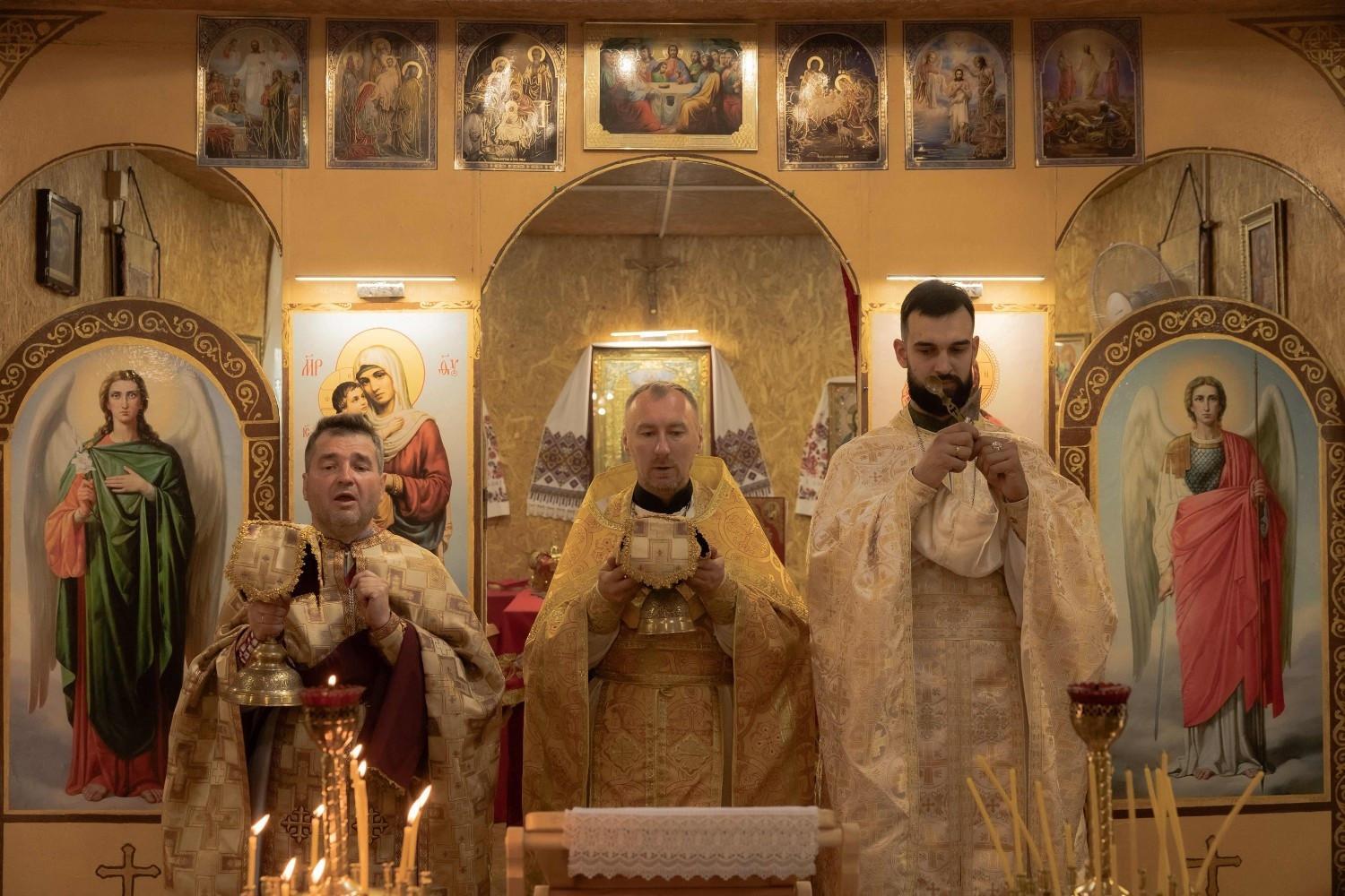 In east Ukraine, rival churches battle for influence