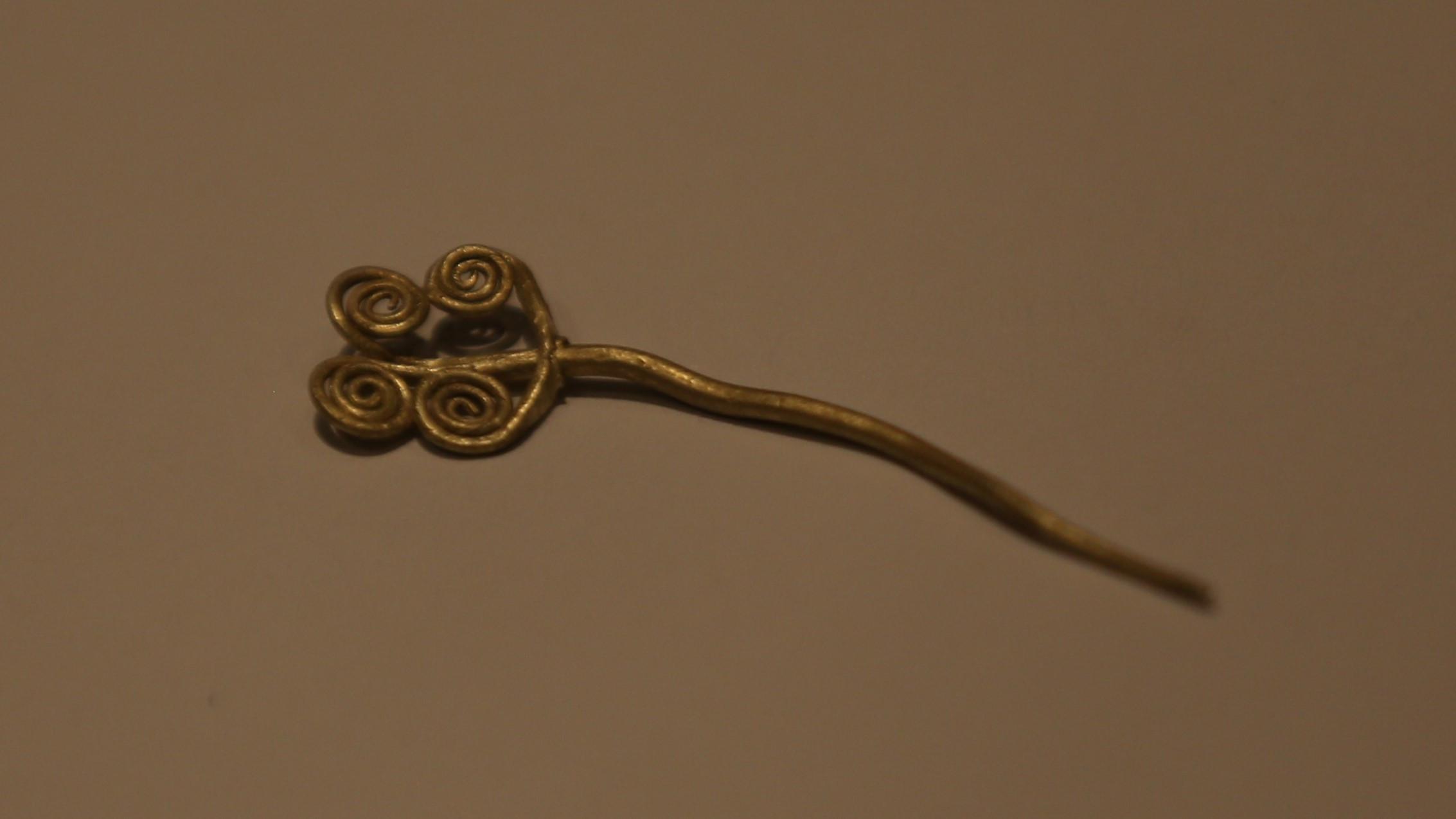 Gold brooch and rare jade stone unearthed in Troy