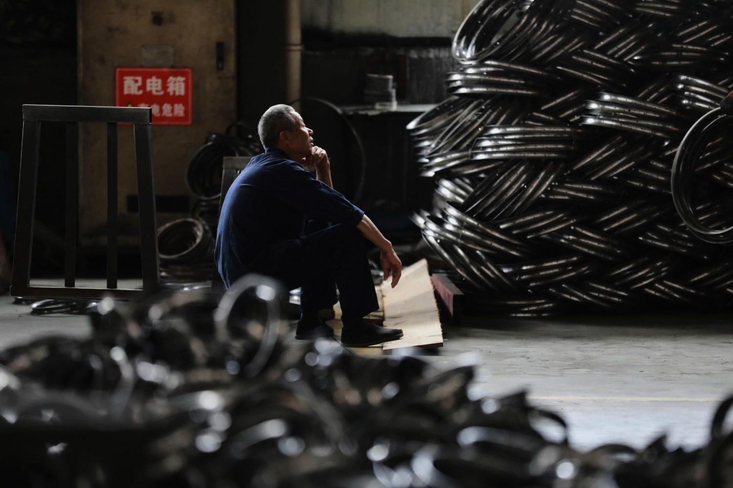 Chinas factory activity shrinks again as trade tensions bite