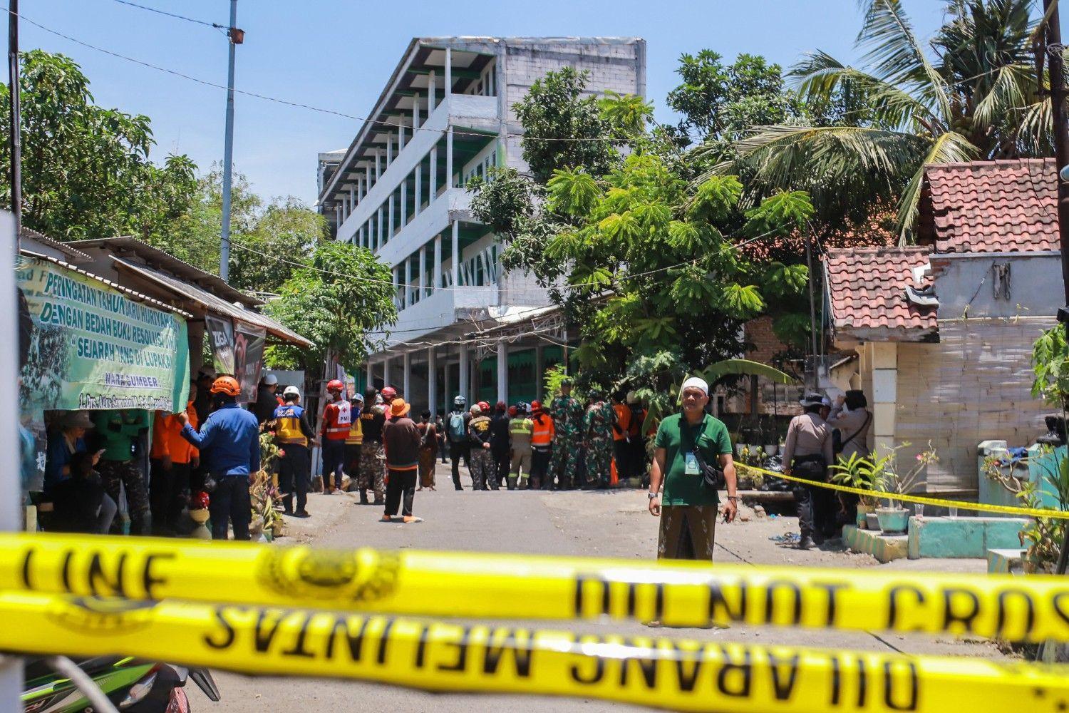 Rescuers say no more signs of life in rubble of collapsed Indonesian school