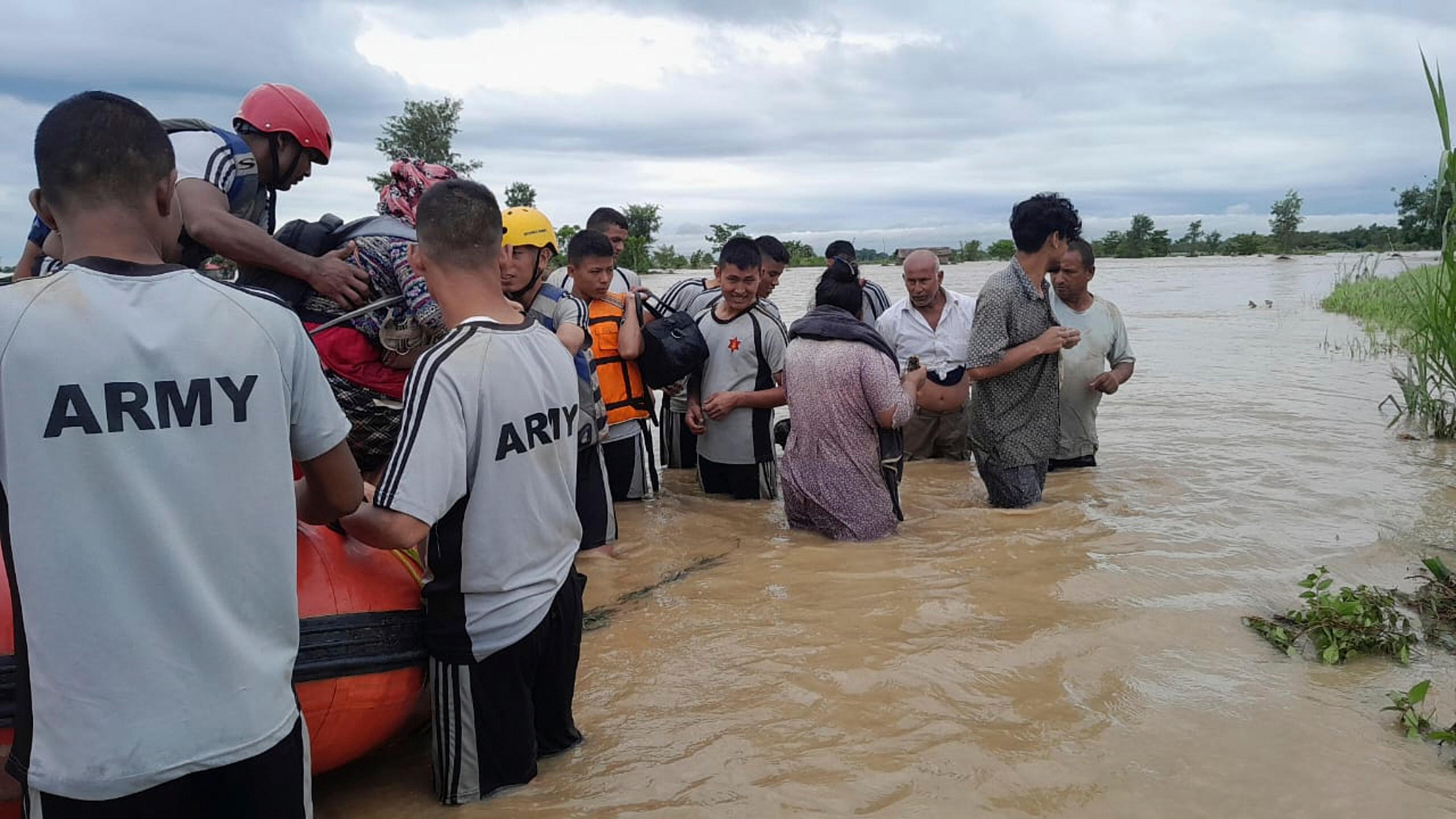 Rescuers scramble to deliver aid after deadly Nepal, India floods