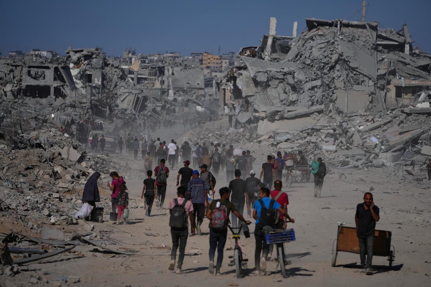 Palestinians return to devastated Gaza City as truce holds