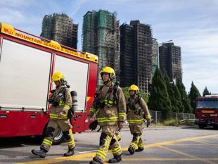 Death toll from Hong Kong fire climbs to 128