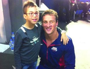 Lochte wins hearts with photo with Turkish kid