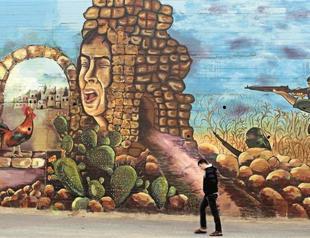 Giant mural tells Palestine’s 3,500-year-old history