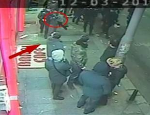 Video footage of policeman handing gun to child raises eyebrows