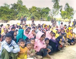 Myanmar detains police over Rohingya abuse video