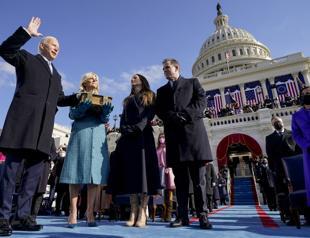 Biden takes the helm, appeals for unity to take on crises