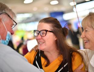 US hits vaccine milestone as NZealand, Australia open travel bubble