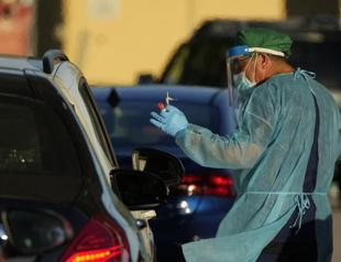 WHO warns of COVID ’tsunami’ as Omicron fuels record surges