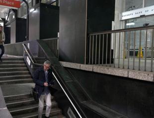 Australia lifts key interest rate, flags further rises