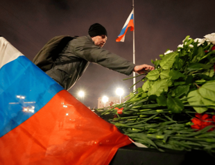 Russia arrests concert hall gunmen as death toll rises to 133