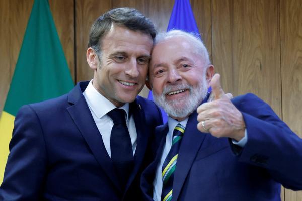 Macron quips about cuddly wedding pics with Lula