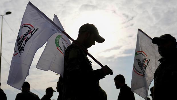 Iraq says arms of mobilization forces will not be collected