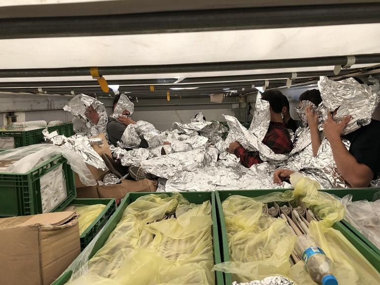 Undocumented migrants wrapped in aluminum foil caught on a truck in Istanbul