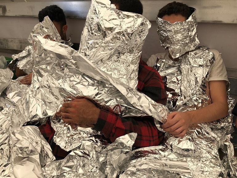 Undocumented migrants wrapped in aluminum foil caught on a truck in Istanbul
