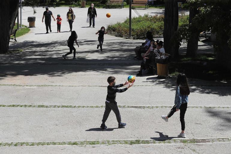 Turks under 14 venture out for four hours as virus rules ease