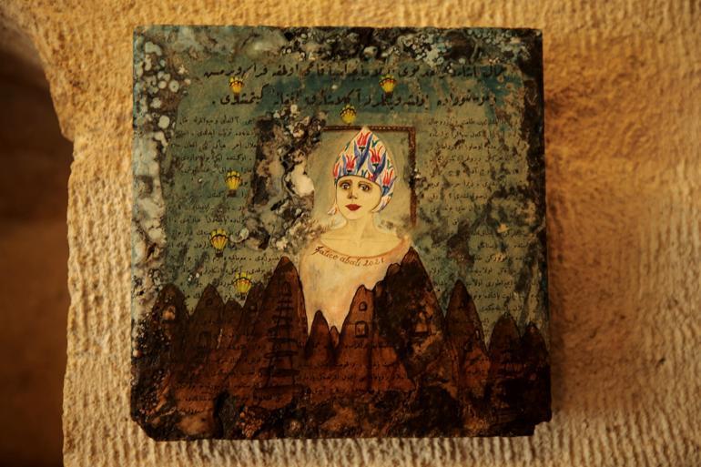 Artist paints fairy girls on Cappadocia rocks