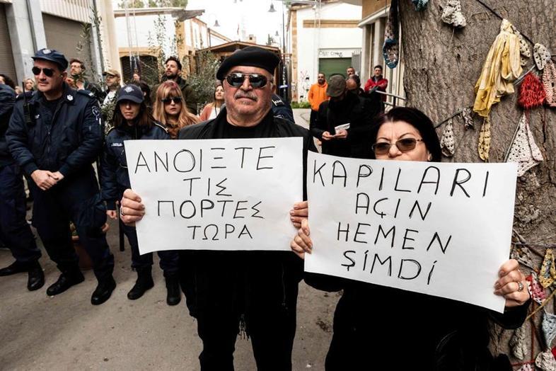 Turkish, Greek Cypriots push aside barriers in divided Nicosia