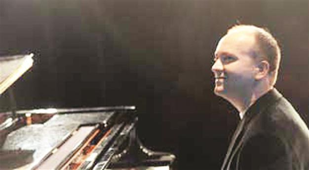 Turkish classical pianist on stage