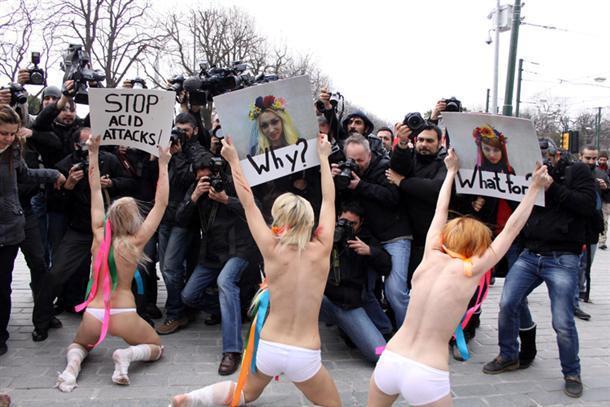 FEMEN members attempt to strip at the airport