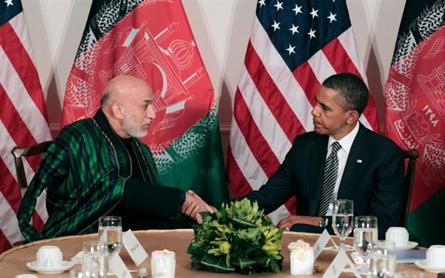 Obama welcomes Karzai call for calm after shooting