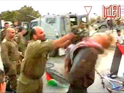 Israel suspends officer who hit protester with gun