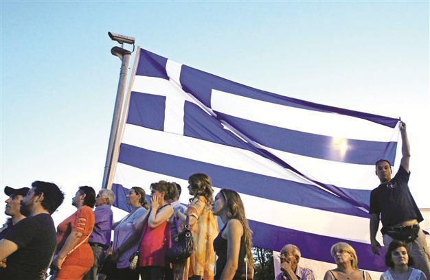 Greeks return to ballots to decide eurozone’s fate