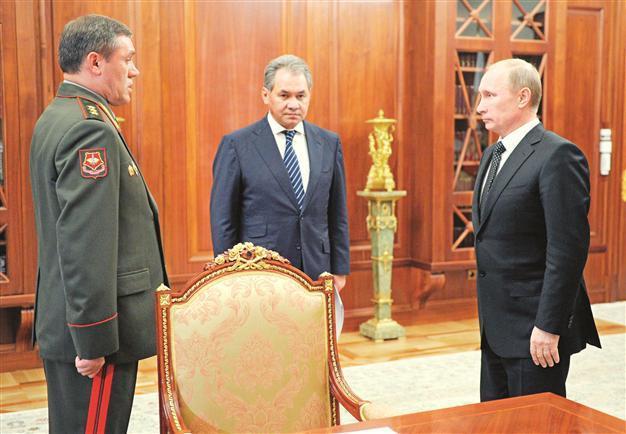 Putin sacks military chief after minister
