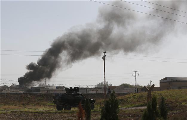 Syria warplanes hit village near Turkish border: AFP