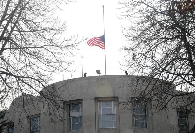 U.S. embassy flag at half mast