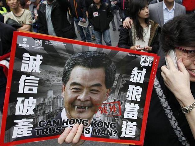 Tens of thousands march against Hong Kong leader