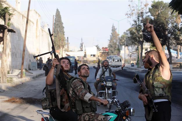 Syria rebels down chopper as regime raids towns: NGO