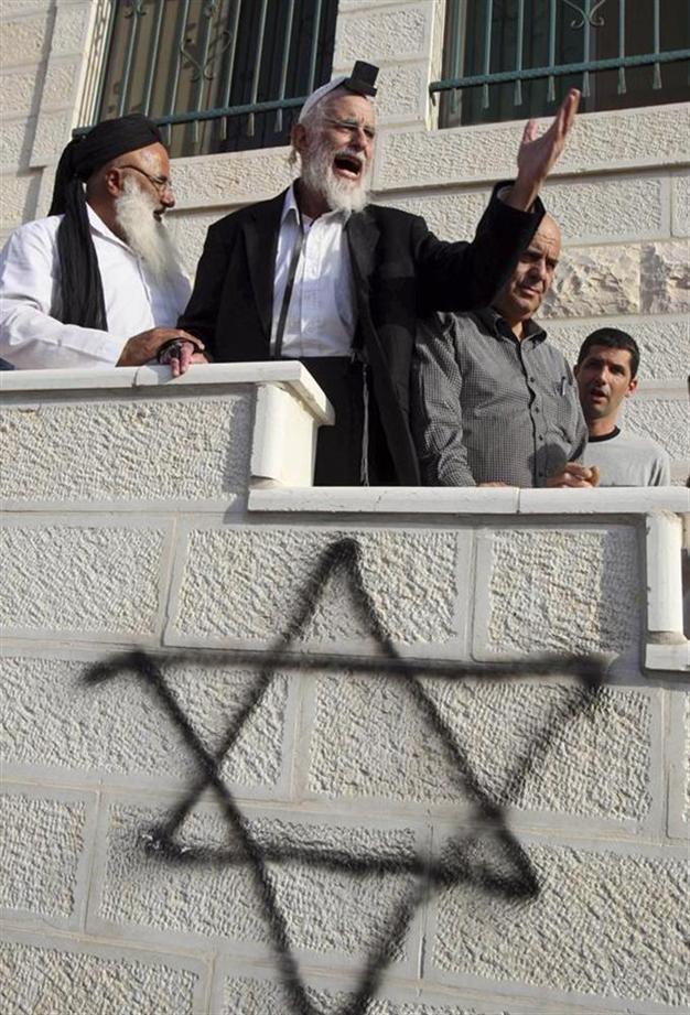 Vandals target West Bank mosques, scrawl threats in Hebrew