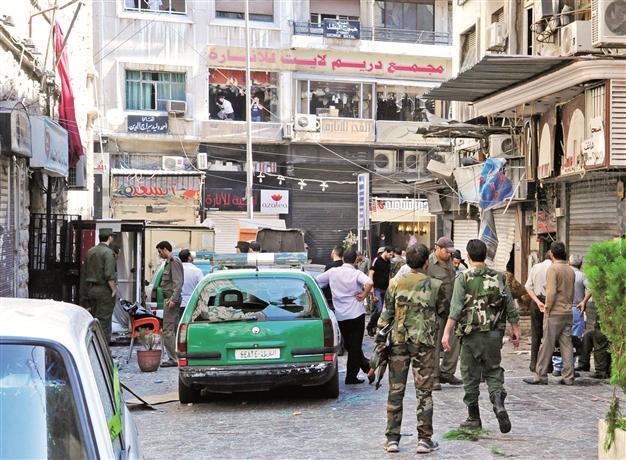 Twin suicide blasts kill at least 14 in central Damascus