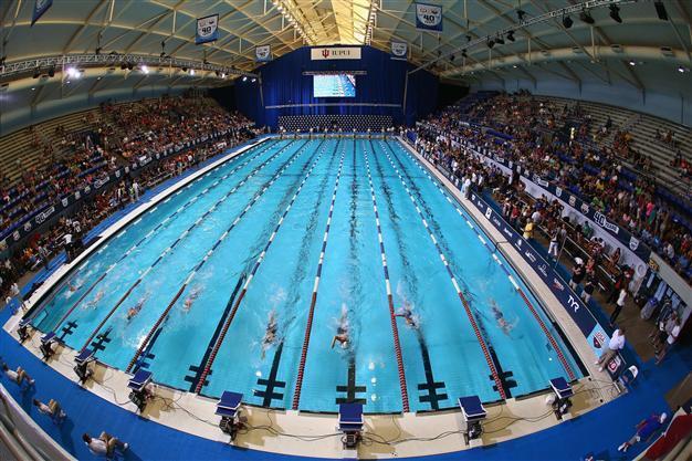 Iran swimmer says record denied over unIslamic costume