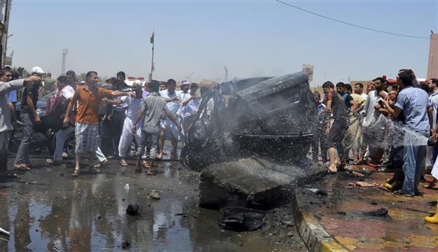 Iraq bomb attack on Shiite religious hall kills 15