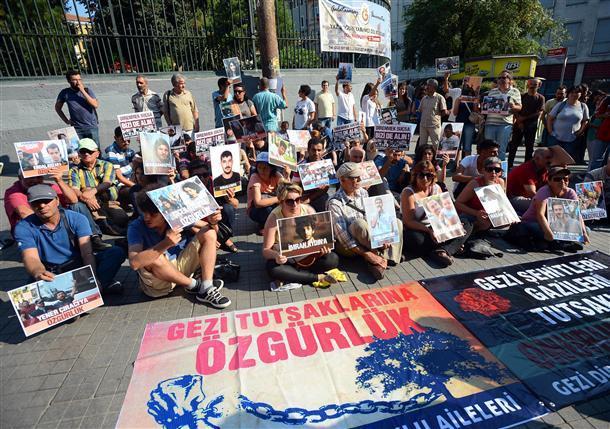 Police fire water cannons to quell protest as baton-wielding shop owners threaten reporters in Istanbul