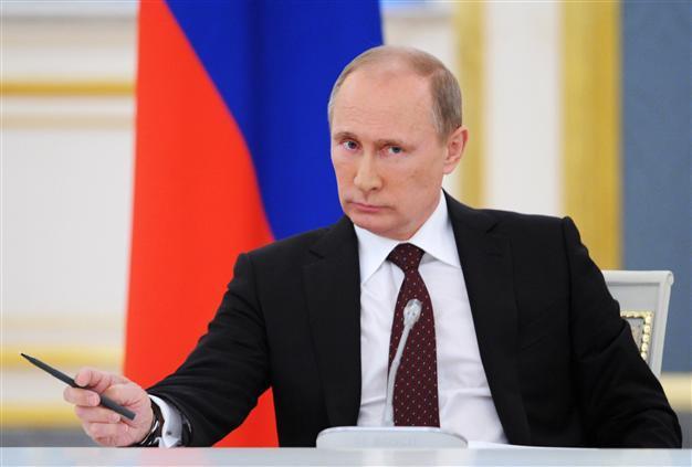 Putin says Syria very actively cooperating on disarmament