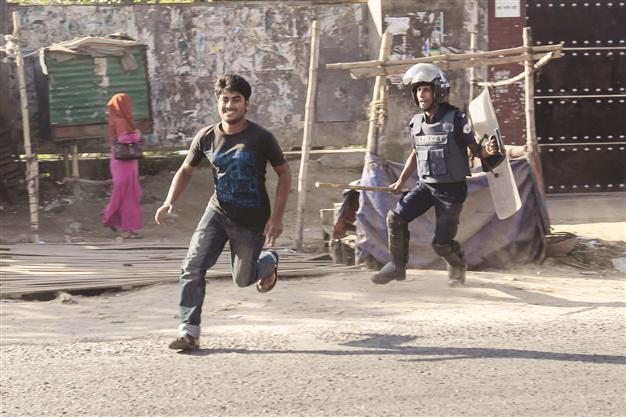 Bangladesh police fire tear gas in clash over wage rise