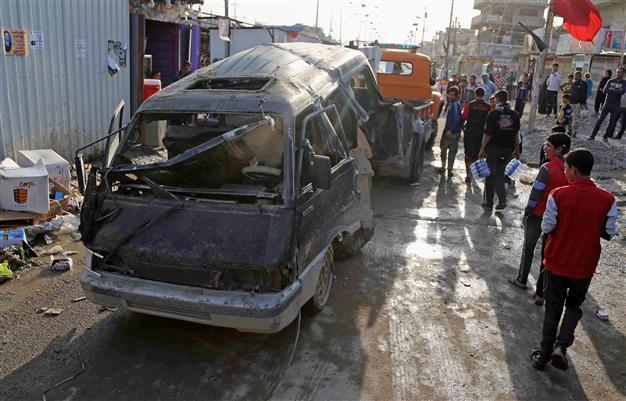 Car bomb near cafe kills 11 in central Iraq