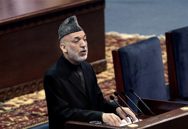 NATO warns Karzai aid at risk if no troop accord