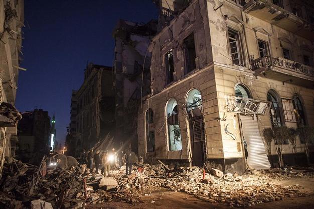 Egypt PM labels Brotherhood terrorist group after bomb kills 14