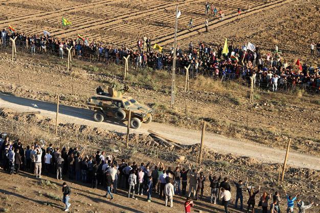 Police resort to tear gas as Kurds protest on both sides of Turkish-Syrian border