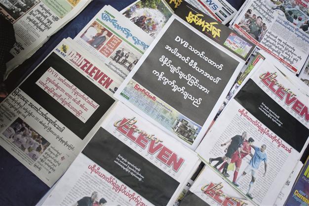 Newspapers in Myanmar print black front pages to protest sentencings