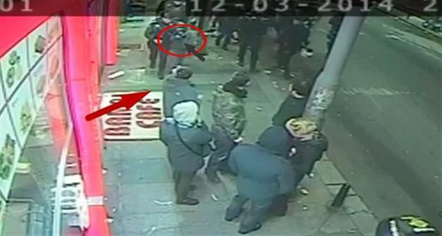 Video footage of policeman handing gun to child raises eyebrows