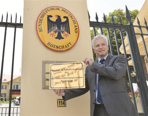 German Embassy refreshes placard with World Cup title